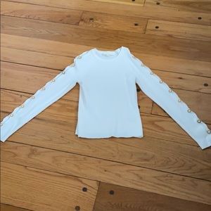 White top with gold accents